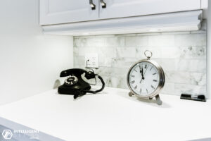 Telephone and Clock in the Shelf